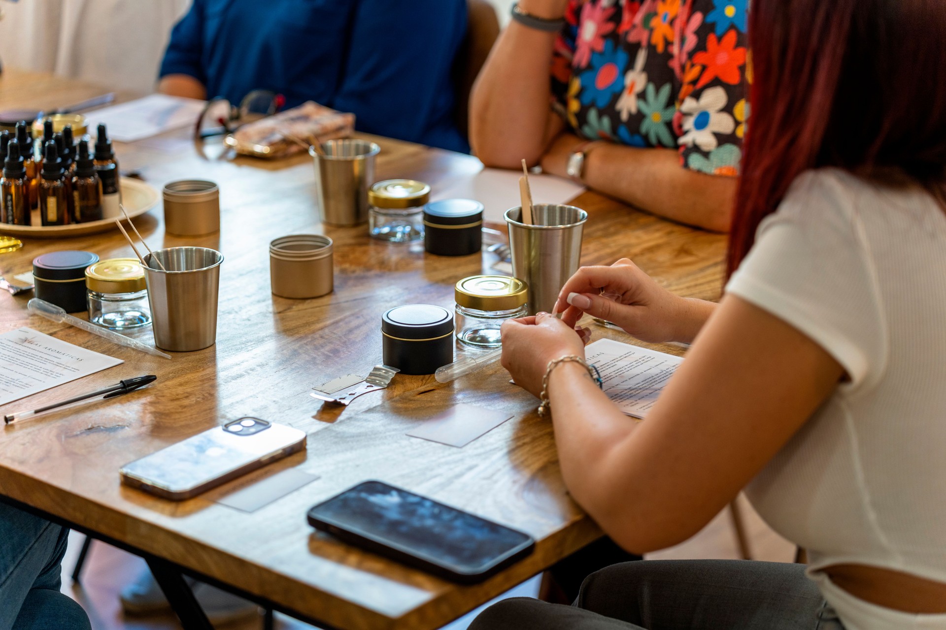 Soy candle workshop. Women choosing the scent of their candle.